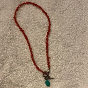 Red stone necklace with blue stone